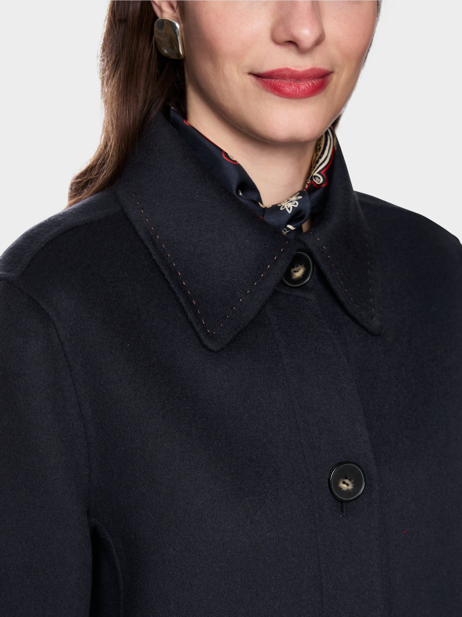 Wool coat with decorative stitching