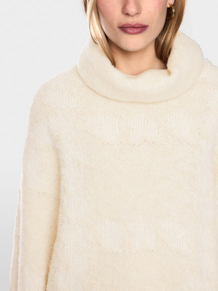 ‘Knitted in Germany’ turtleneck jumper