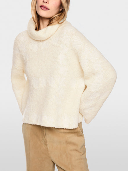‘Knitted in Germany’ turtleneck jumper