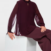 Pleated blouse with feminine details