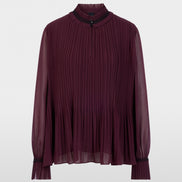 Pleated blouse with feminine details