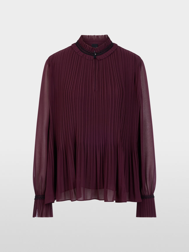 Pleated blouse with feminine details