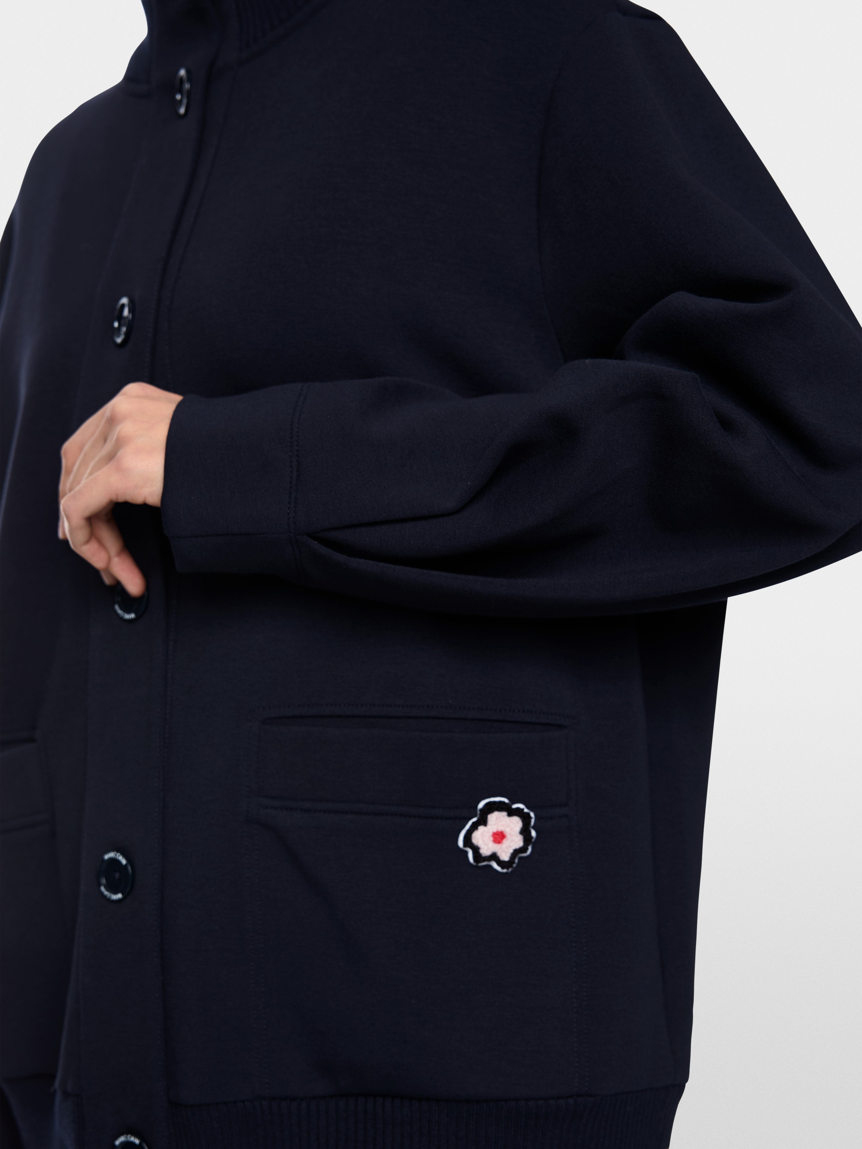Jacket with knitted details