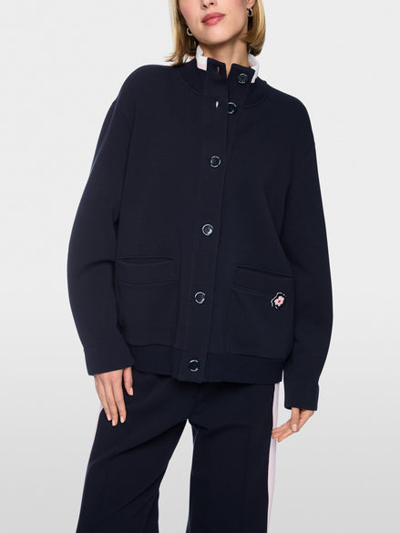 Jacket with knitted details