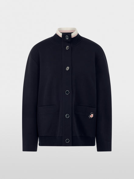 Jacket with knitted details