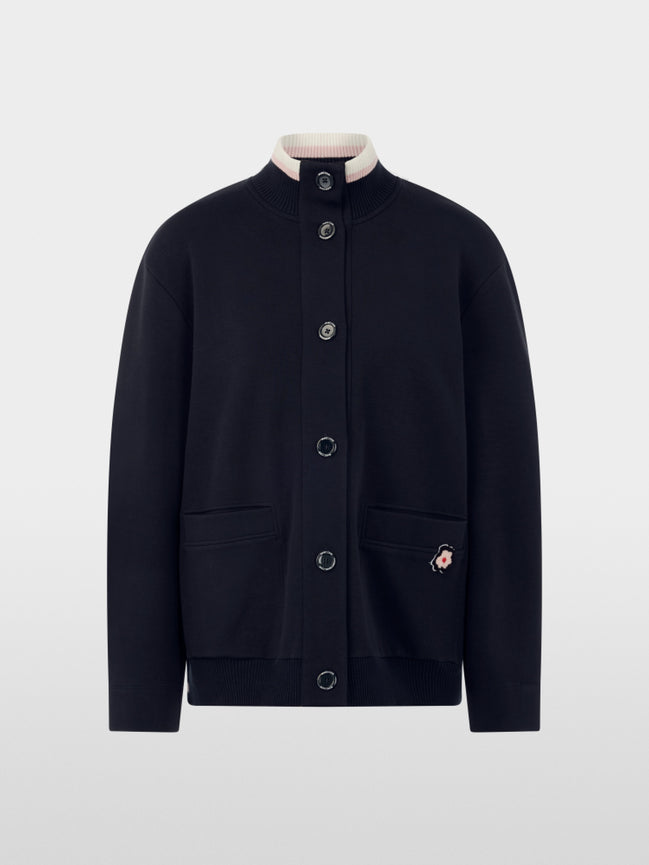 Jacket with knitted details