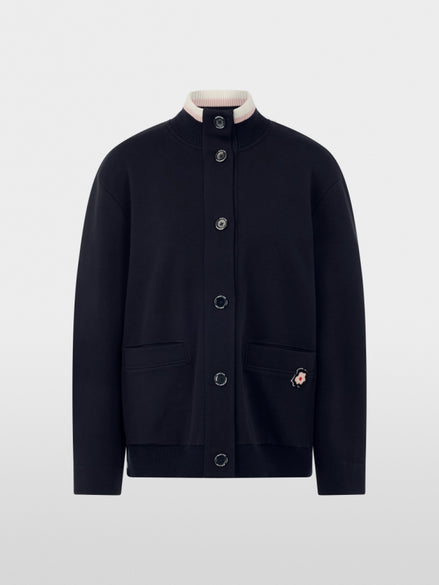 Jacket with knitted details