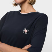 Short-sleeved shirt with floral patch