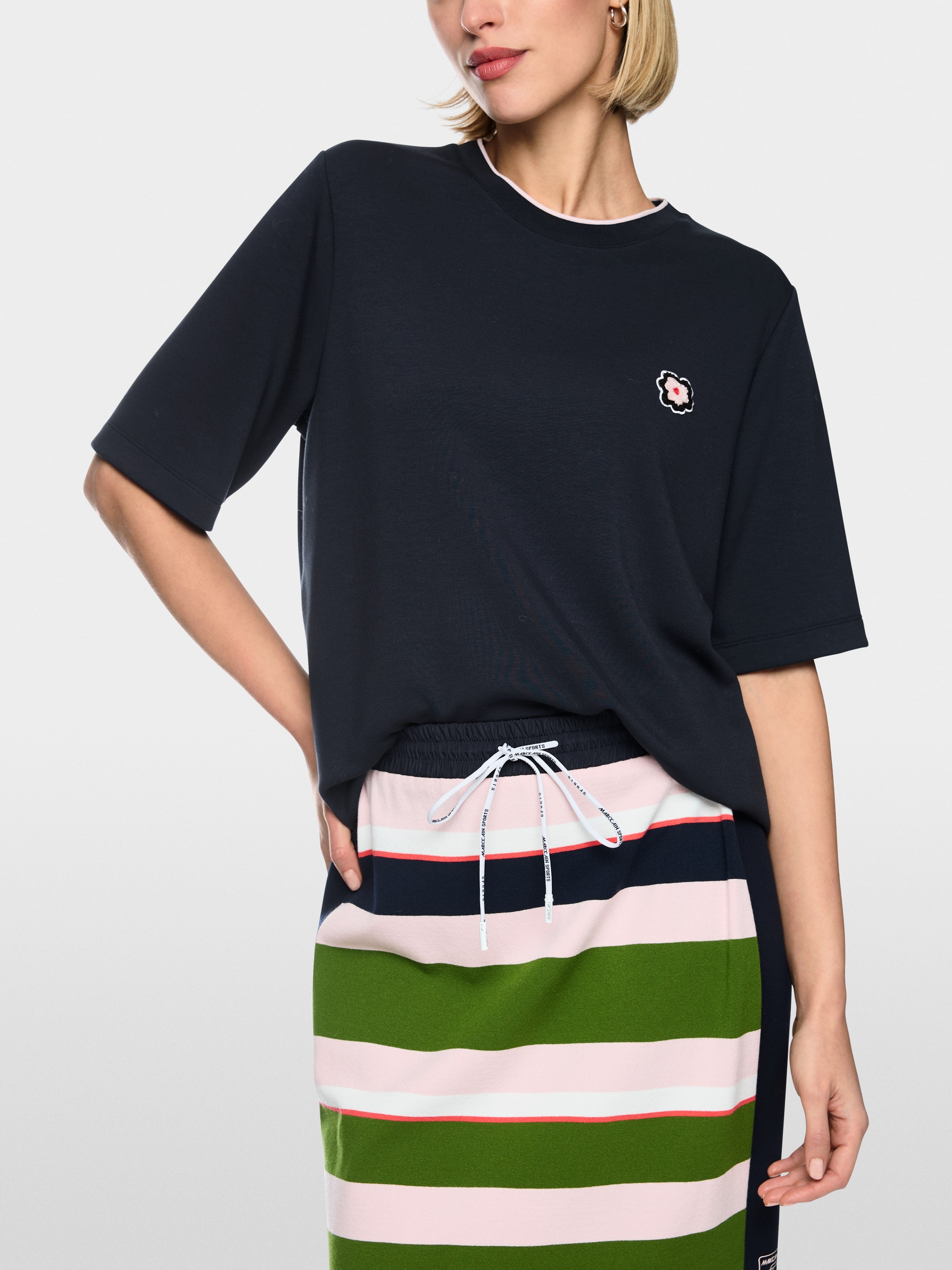 Short-sleeved shirt with floral patch
