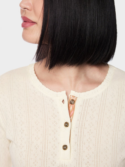 Long-sleeved buttoned openwork top