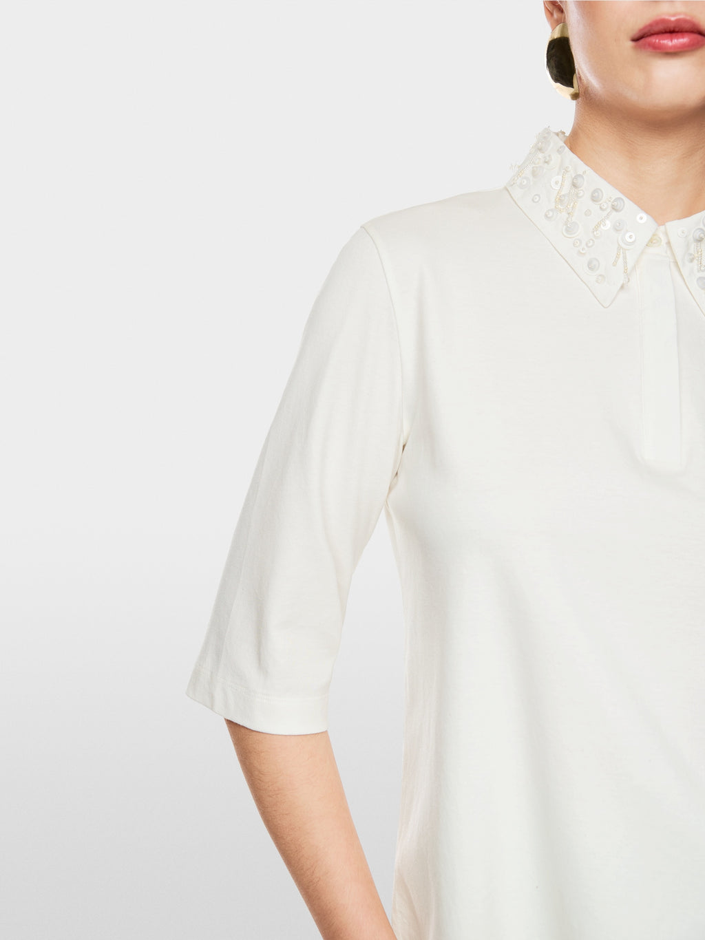 Polo shirt with decorative pearls