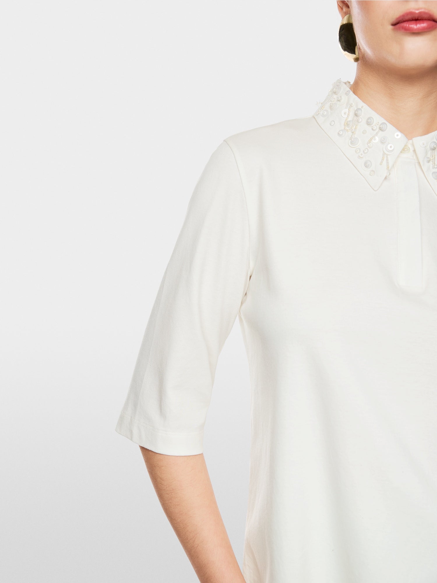Polo shirt with decorative pearls
