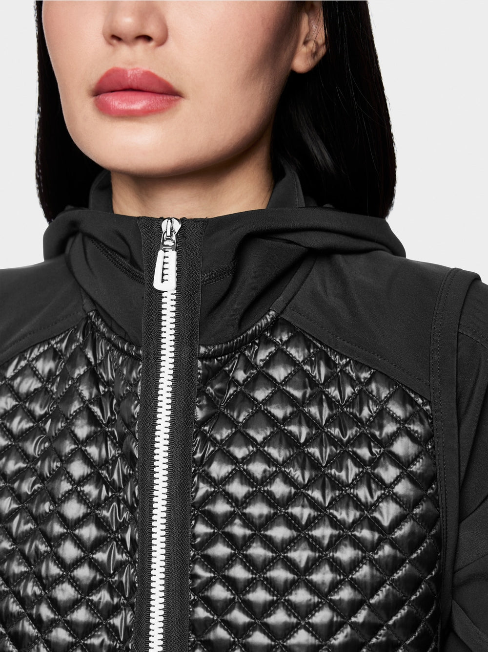Bodywarmer with shiny look and hood