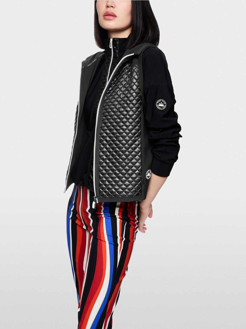 Bodywarmer with shiny look and hood