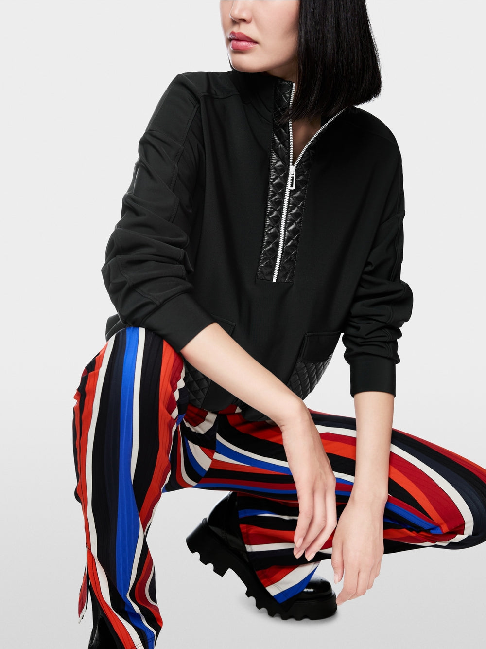 Sweater with stand-up neck and pockets